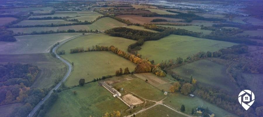 Aerial view of rural land ready for flipping, ideal for real estate investors exploring land investing strategies.