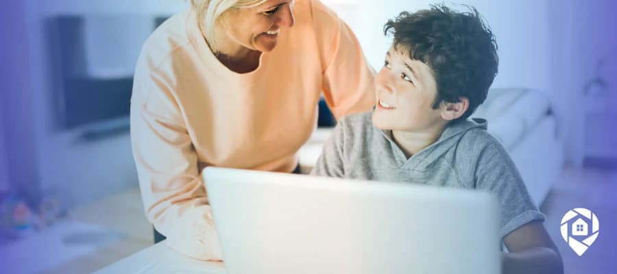 Mom building a real estate business from home while spending time with her child.