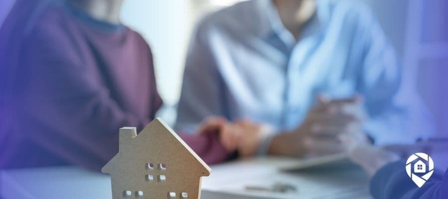 Real estate agent meeting with clients to build trust and long-term relationships in the Colorado housing market.