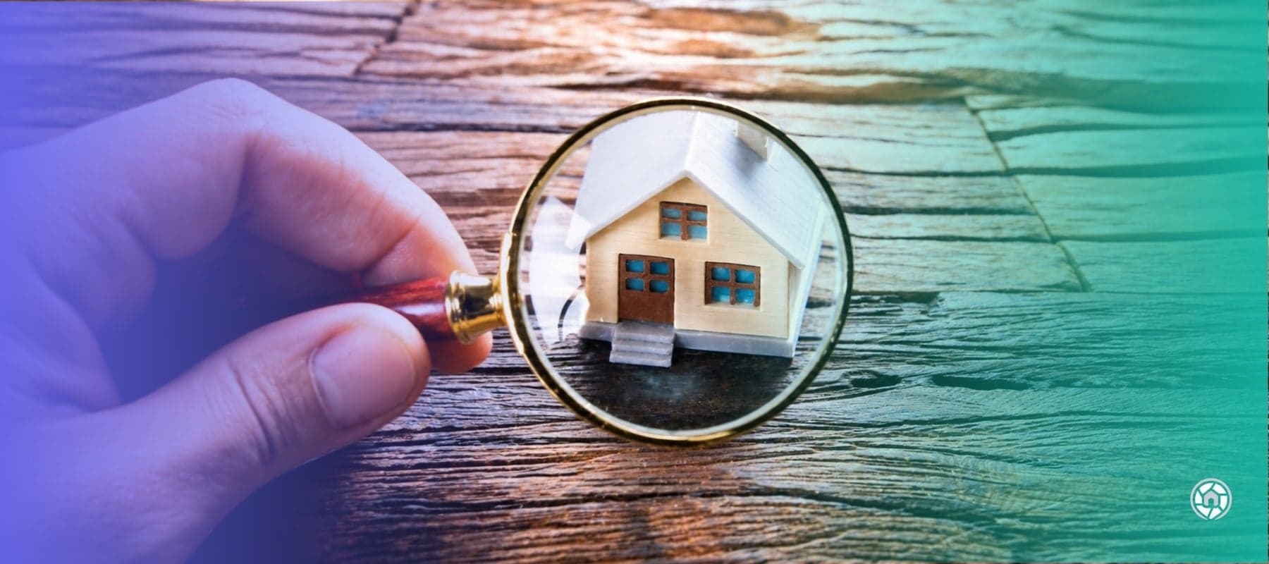 Magnifying glass over a small home